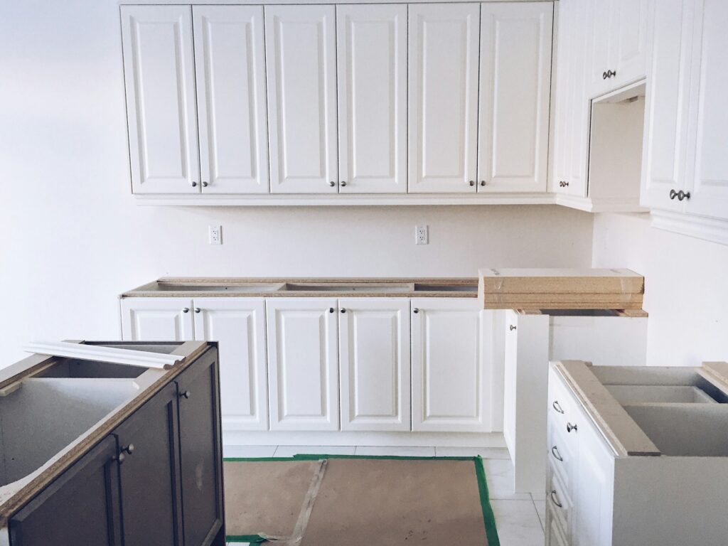 Beautiful white kitchen under construction, remodeling